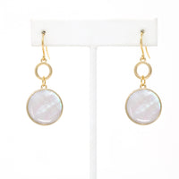 Gold-tone drop earrings with round mother of pearl shell inlays and circular link accents.