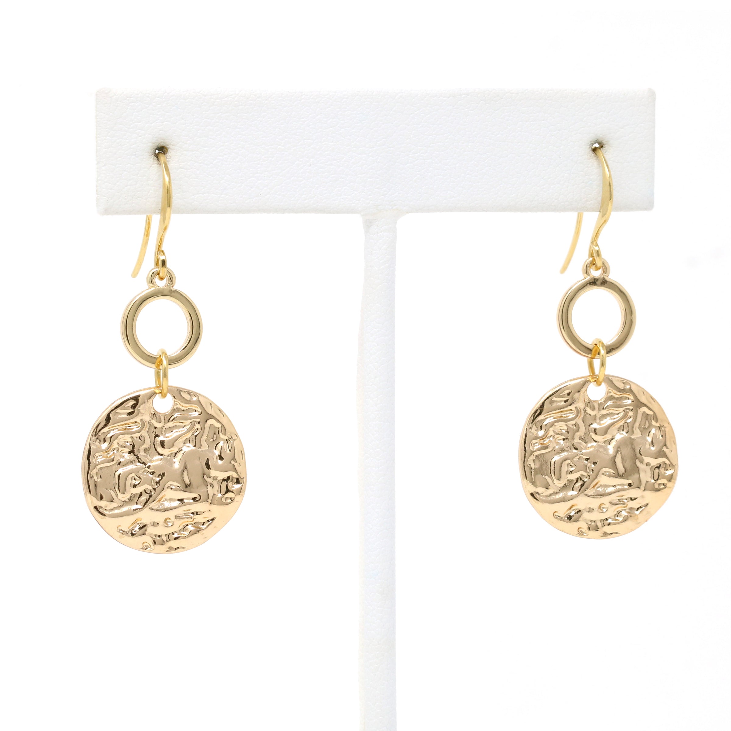 A pair of hammered charm drop and dangle earrings in gold.