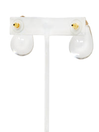 Clear lucite puffy teardrop earrings feature sleek and polished transparent resin teardrops that catch the light beautifully.