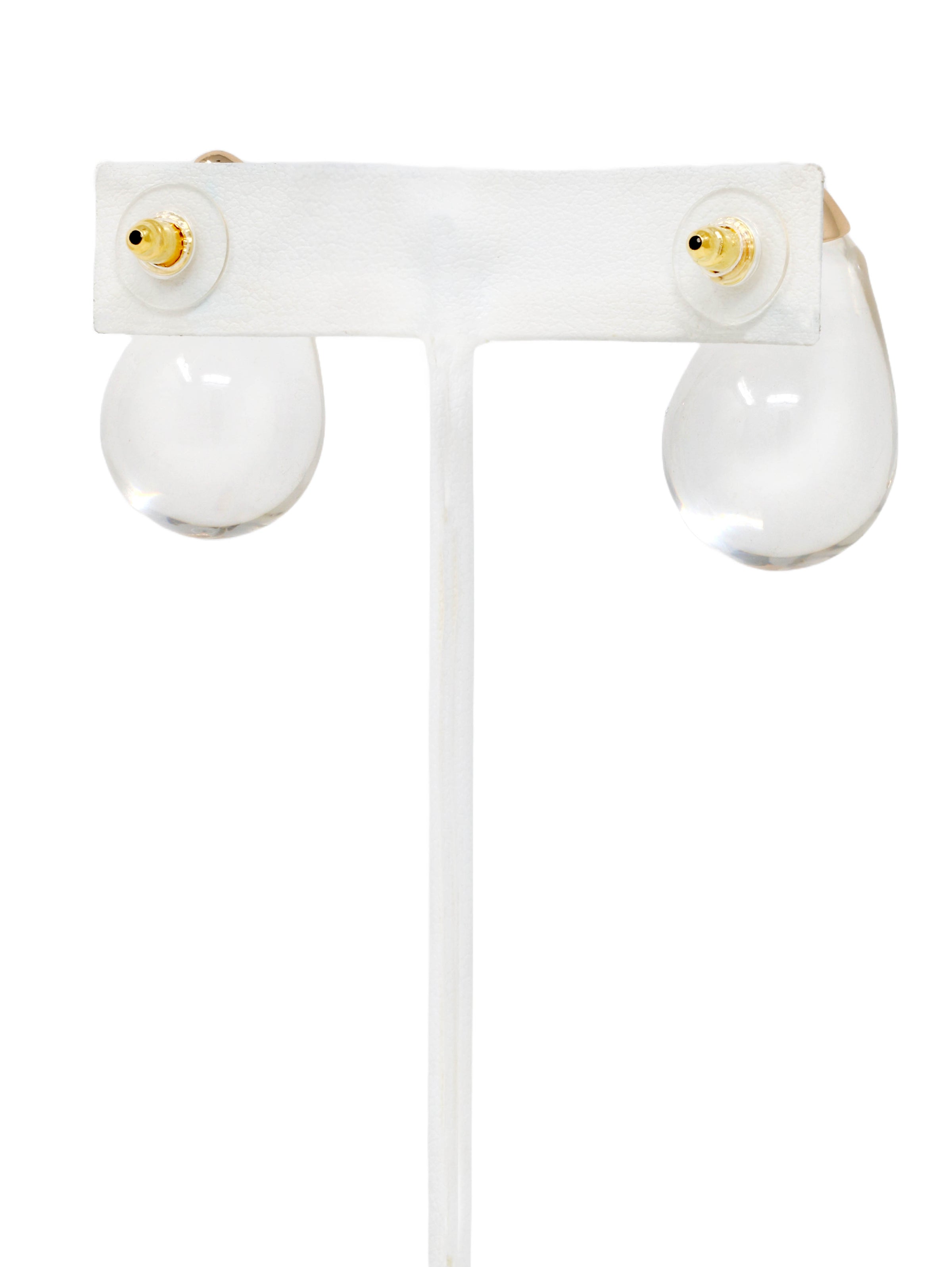 Clear lucite puffy teardrop earrings feature sleek and polished transparent resin teardrops that catch the light beautifully.