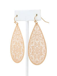 Gold teardrop earrings with intricate patterns on a white background.