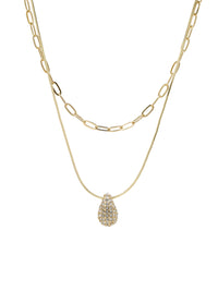 Gold double-layered necklace with a puffy crystal-paved teardrop charm, featuring a snake chain and a paperclip chain design.