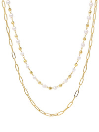An elegant double-layered pearl necklace featuring a sophisticated paperclip chain in a radiant gold finish, combining classic pearls with modern design for a timeless and stylish accessory.
