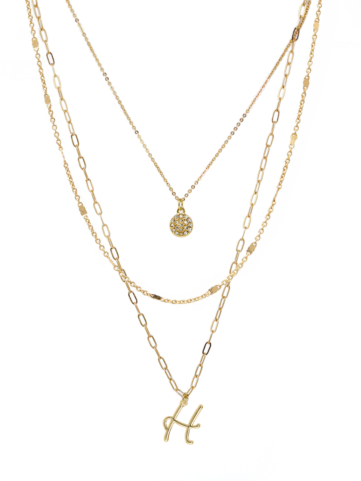 A three-layered gold necklace featuring a script initial charm and a small circle charm paved with stones.