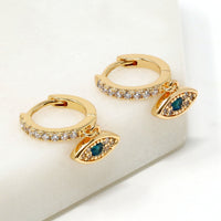 A pair of evil eye drop and dangle earrings in gold filled.