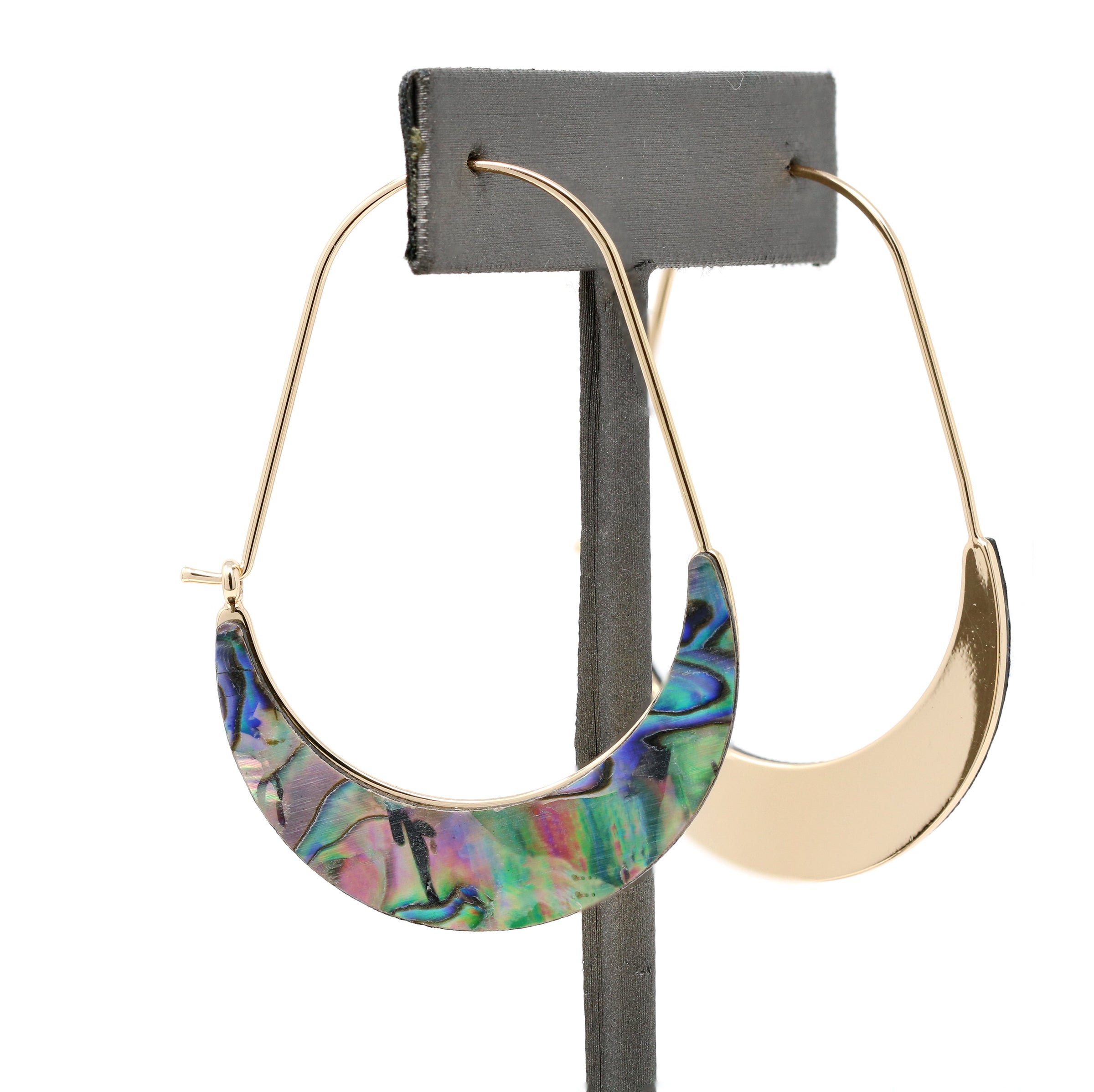 A pair of crescent-shaped hoop earrings featuring iridescent abalone shell inlays with vibrant shades of green, blue, purple, and pink. The earrings are set on delicate gold-tone wire hoops.