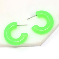 Featuring a pair of minimalist design bold resin hoop earrings crafted with high-quality neon green colored resin material, adding a pop of color to any outfit.