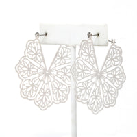 A pair of floral patterned filigree lightweight statement hoop earrings in silver.