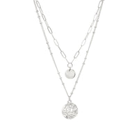 A two-layered paperclip chain necklace in silver dangled with two small charms.