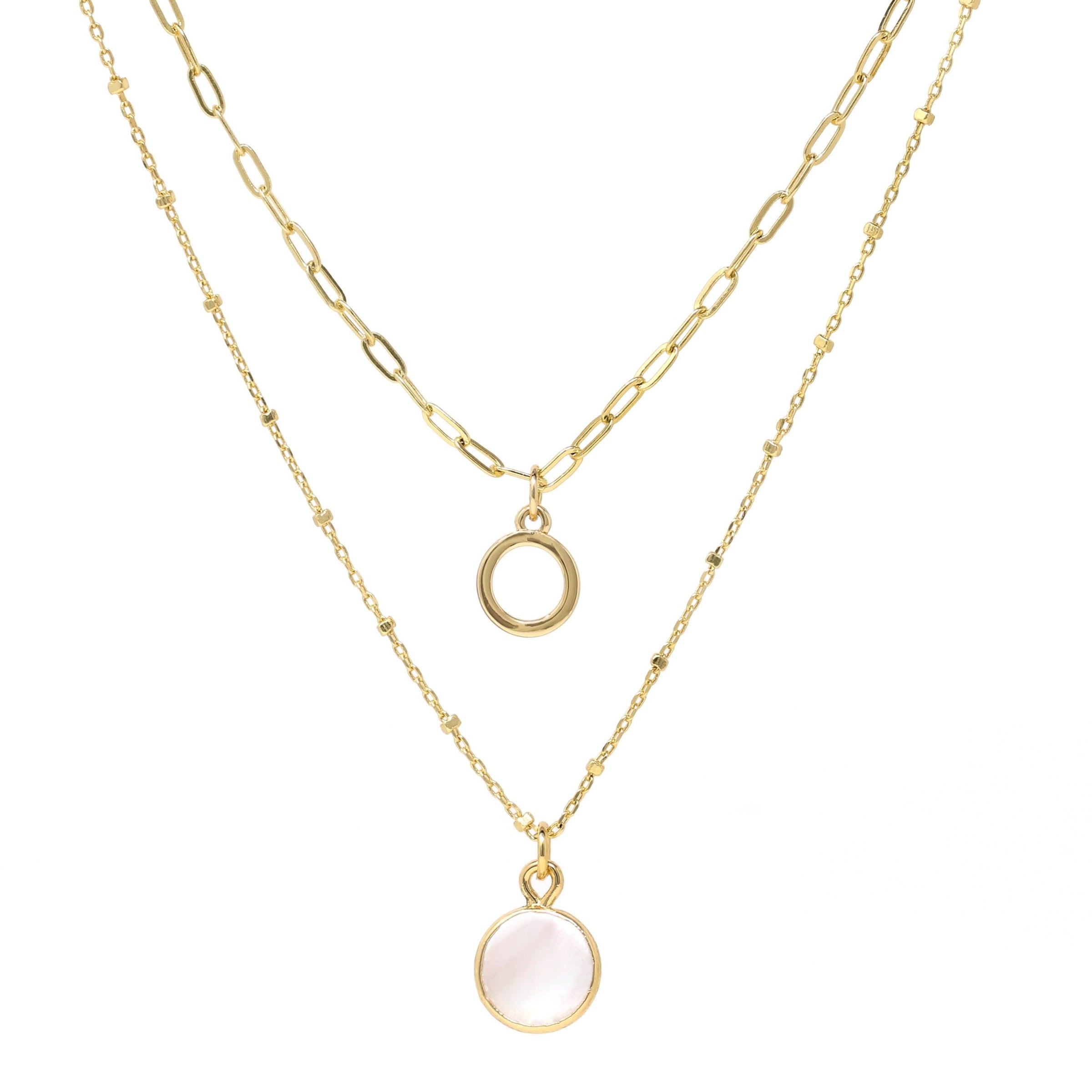 A set of double layer necklace in gold with a small disc and a gold trimmed mother of pearl charm.