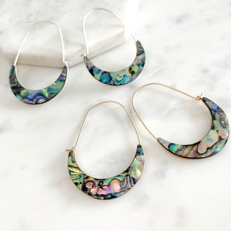 A pair of natural abalone crescent hoop earrings.