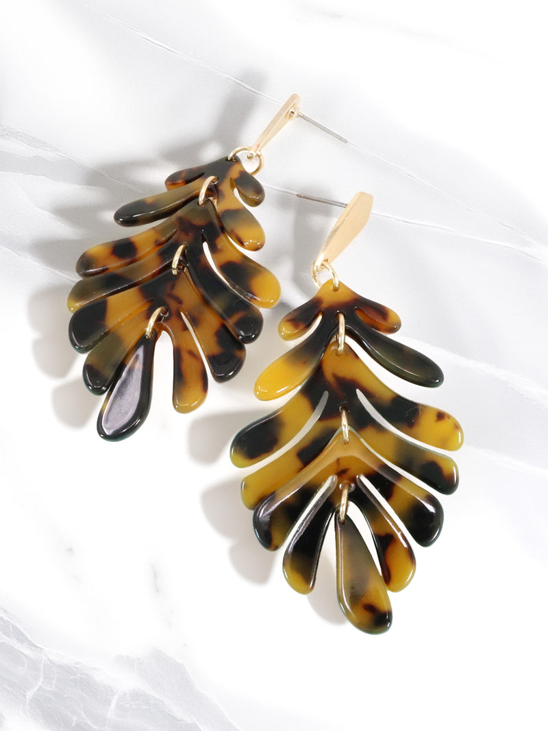 Tortoiseshell leaf-shaped earrings on a white background