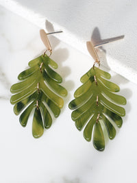 Olive green resin leaf-shaped earrings on a white background