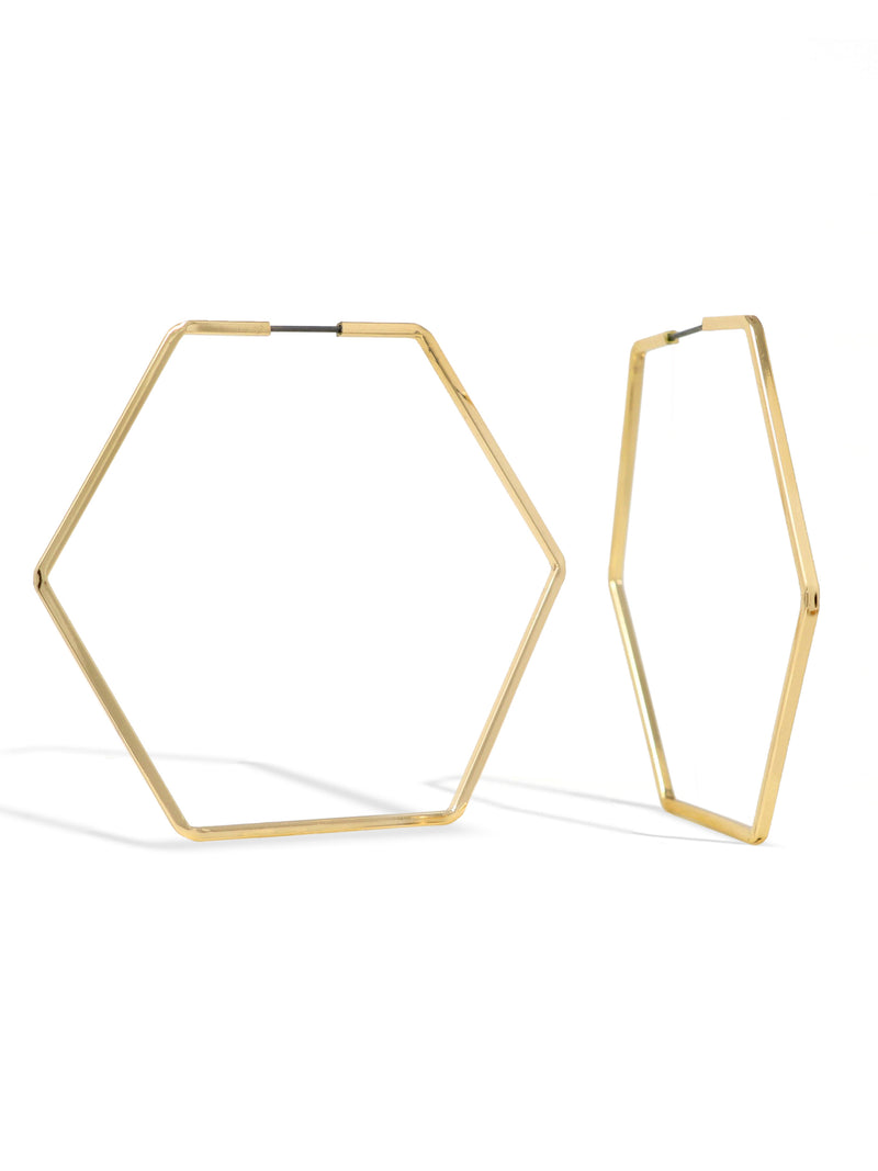 Gold hexagonal hoop earrings on a white background