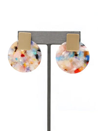 Multicolored round earrings with gold posts on a gray stand.