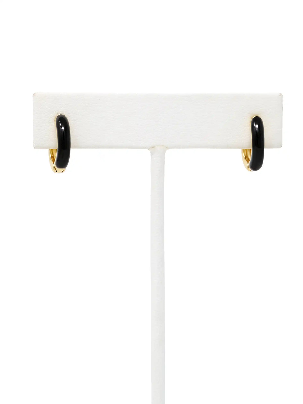 A pair of small gold-plated huggie hoop earrings featuring contrasting colorful black epoxy accents in a modern, compact design.
