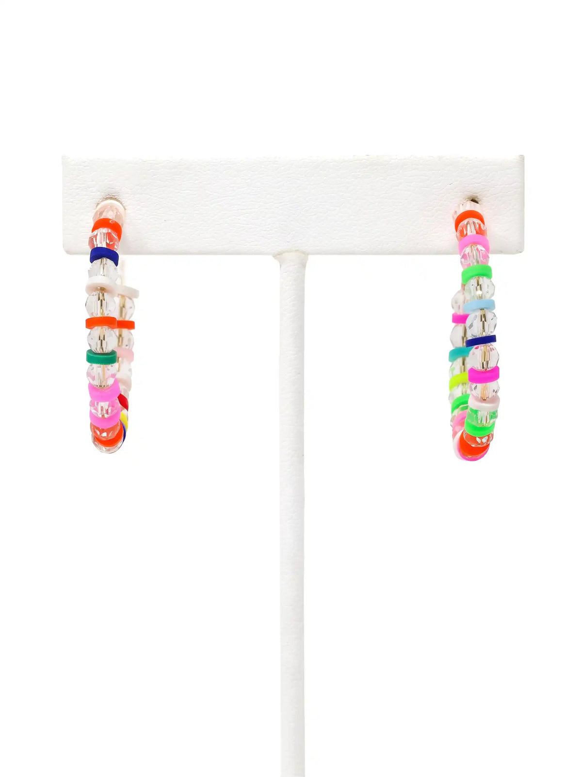 A pair of lightweight clear glass beaded hoop earrings with multicolored rubber bead accents and gold-tone details by Bauble Sky.