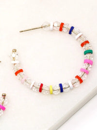 Lightweight clear glass beaded hoop earrings with multicolored rubber bead accents and gold-tone details by Bauble Sky.