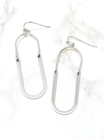 Silver u-shape metal drop and dangle earrings on a white background