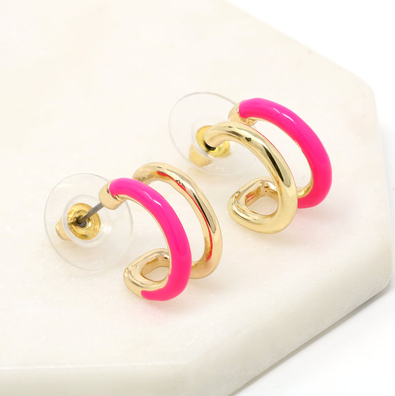 Double hoop earrings featuring neon pink and metal hoops for a bold and stylish look.