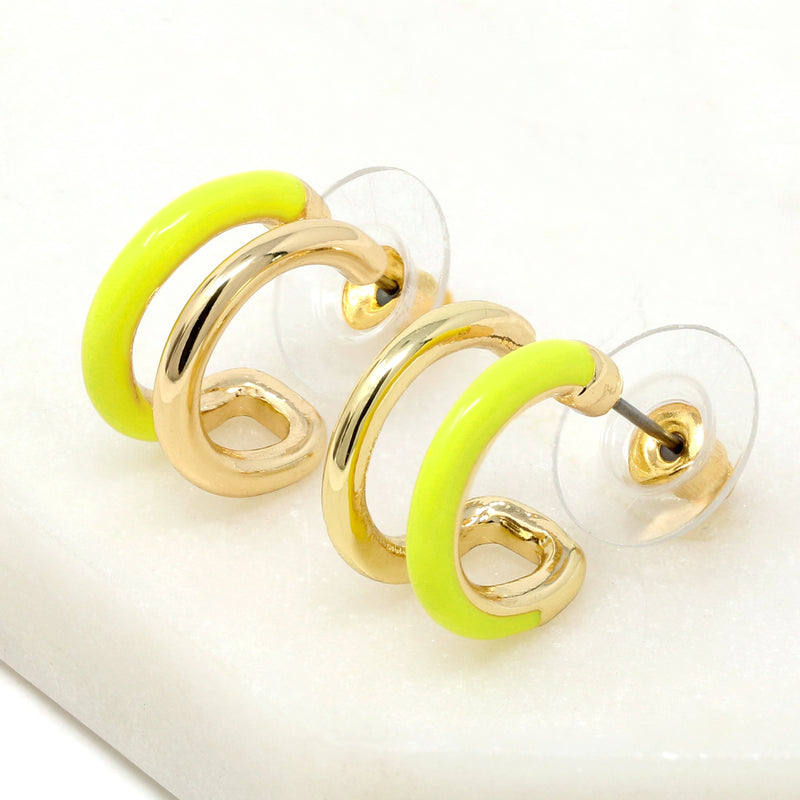 Double hoop earrings featuring neon yellow and metal hoops for a bold and stylish look.