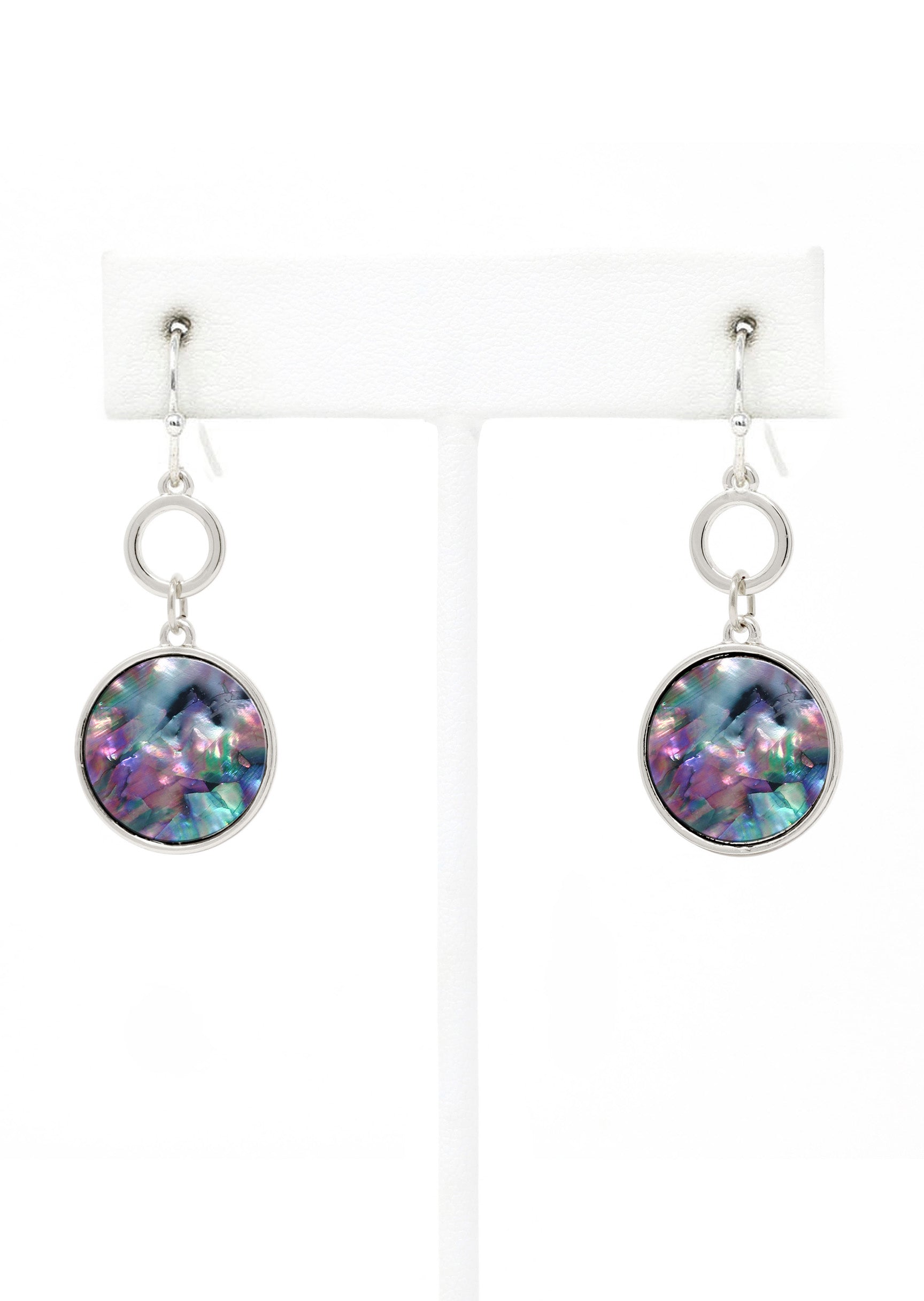 Multicolored round earrings on white stands