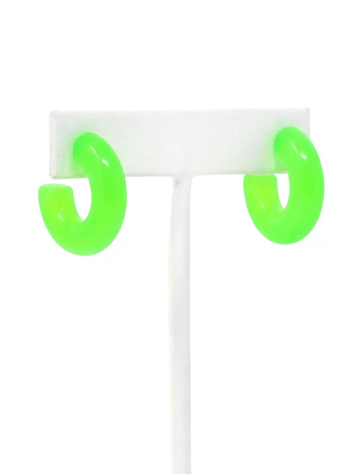 A pair of neon green colored resin hoop earrings with a bold rounded 25mm design.