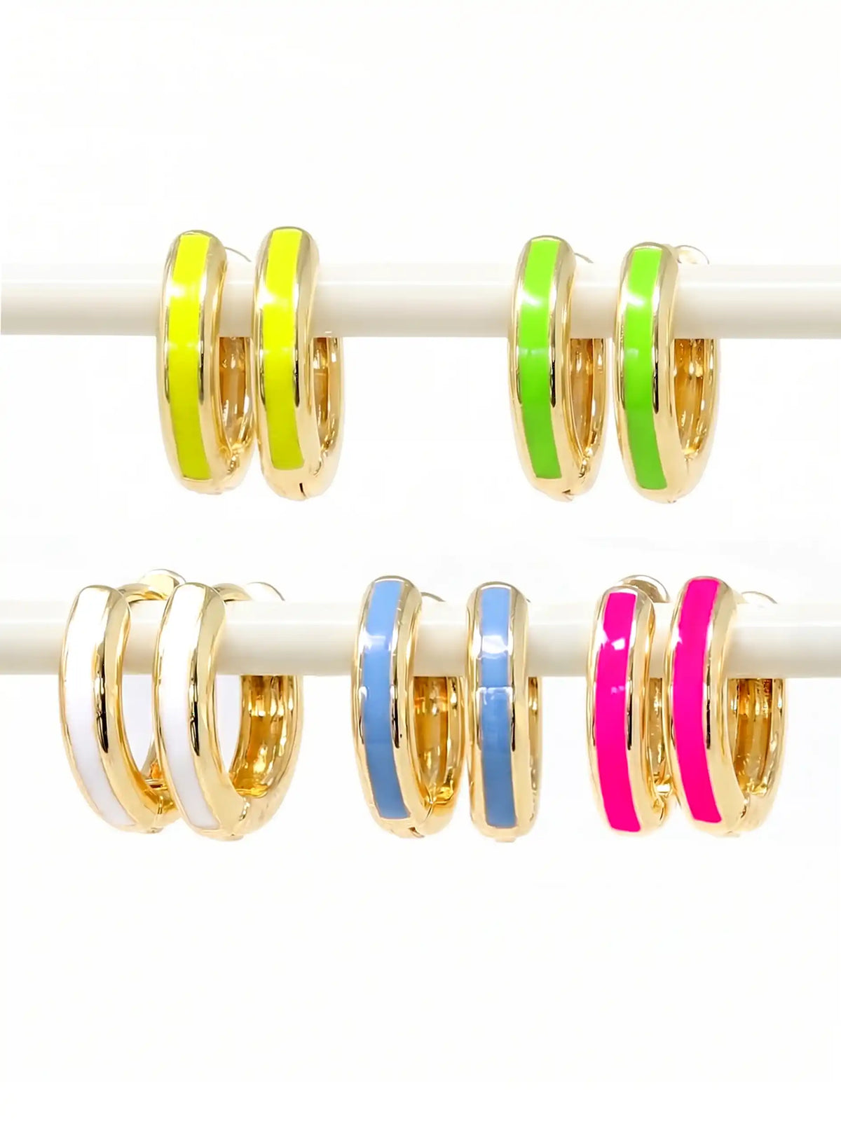 Five pairs of 15mm gold-plated huggie hoop earrings with a vibrant neon yellow, geen, pink, white, and tranquil blue epoxy color accent on one side.