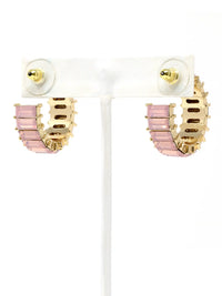 Pair of earrings with pink and gold design on a white background