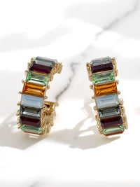 Multicolored glass stone earrings on a white background