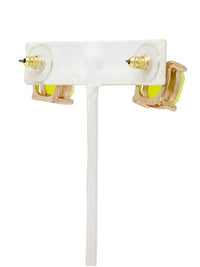 Pair of earrings with gold accents and clear stones on a white background
