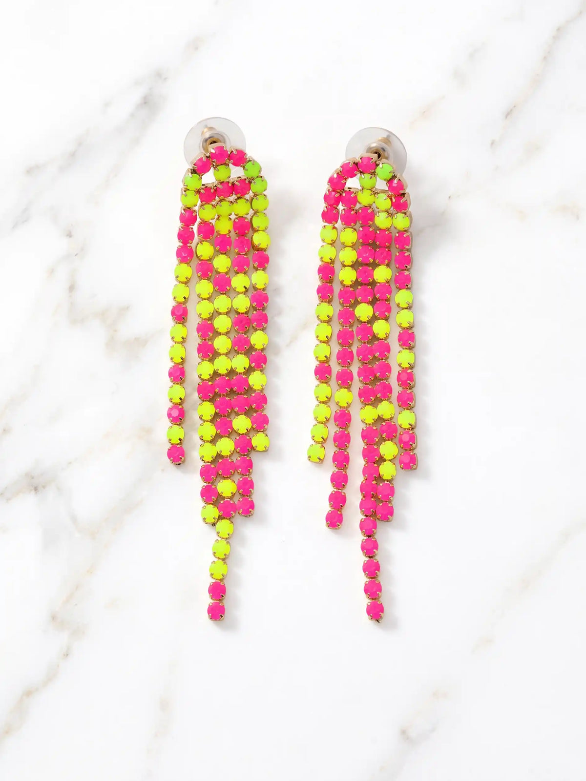 A pair of long, colorful neon shoulder duster earrings featuring multiple vibrant segments, such as bright pink, orange, yellow, and green. The colorful elements dangle elegantly from simple gold or silver hooks. The earrings are typically displayed in a high-resolution close-up shot, possibly on a minimalist geometric stand or worn by a model to showcase their dramatic length and scale against a clean, neutral background.