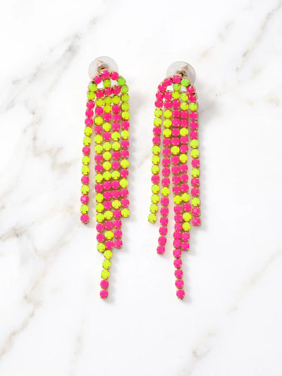 A pair of long, colorful neon shoulder duster earrings featuring multiple vibrant segments, such as bright pink, orange, yellow, and green. The colorful elements dangle elegantly from simple gold or silver hooks. The earrings are typically displayed in a high-resolution close-up shot, possibly on a minimalist geometric stand or worn by a model to showcase their dramatic length and scale against a clean, neutral background.