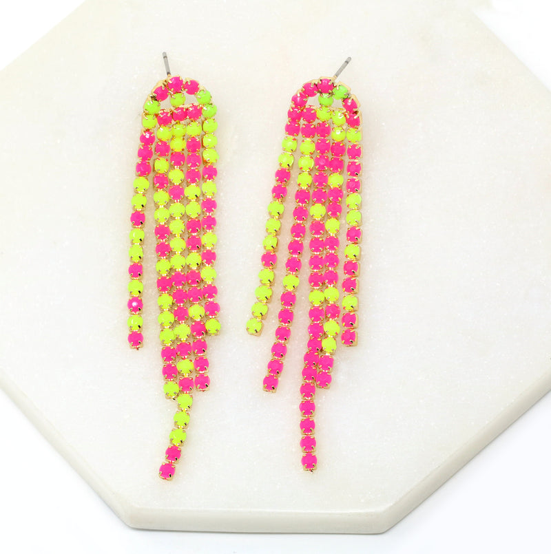 A pair of neon pink colored stone chain shoulder duster earrings.