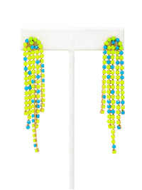 Overhead shot of a pair of long, cascading duster earrings featuring tiered strands of vibrant neon yellow-green and bright turquoise-blue faceted beads set in gold-tone metal.