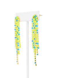 Overhead shot of a pair of long, cascading duster earrings featuring tiered strands of vibrant neon yellow-green and bright turquoise-blue faceted beads set in gold-tone metal.