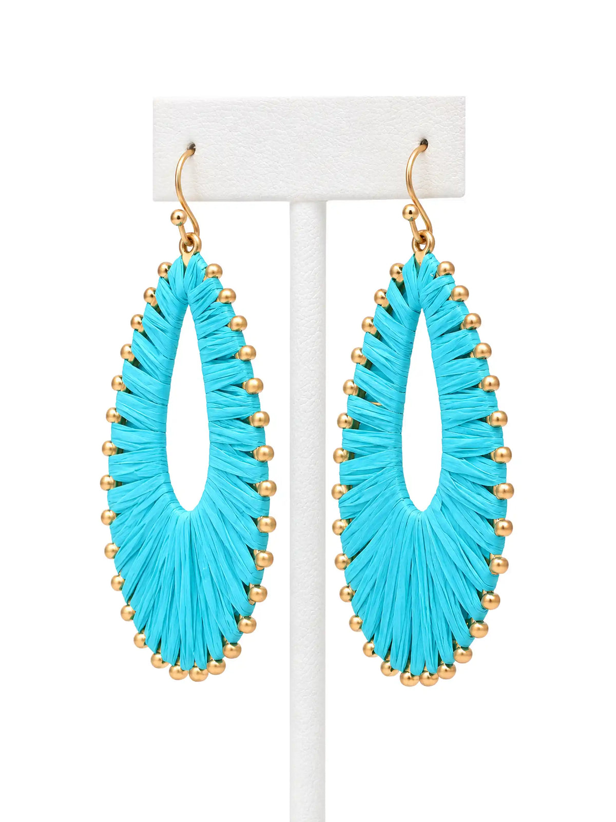 Colorful woven natural raffia teardrop drop earrings in turquoise, white and hot pink with gold-plated brass metal.