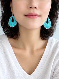 Colorful woven natural raffia teardrop drop earrings in turquoise, white and hot pink with gold-plated brass metal.