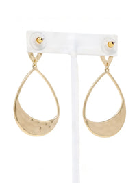 A pair of gold teardrop-shaped drop earrings with a hammered texture on the lower half, displayed on a white plastic jewelry stand against a white background.
