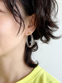 Pair of clear Lucite hoop earrings by Bauble Sky featuring polished transparent resin, gold-tone accents, and a modern minimalist design.