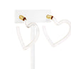 A pari of heart shaped hoop earrings feature a sleek and polished transparent resin that catches the light beautifully.