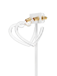A clear acrylic heart-shaped necklace with gold-tone hardware and a white display stand, shown against a solid white background.