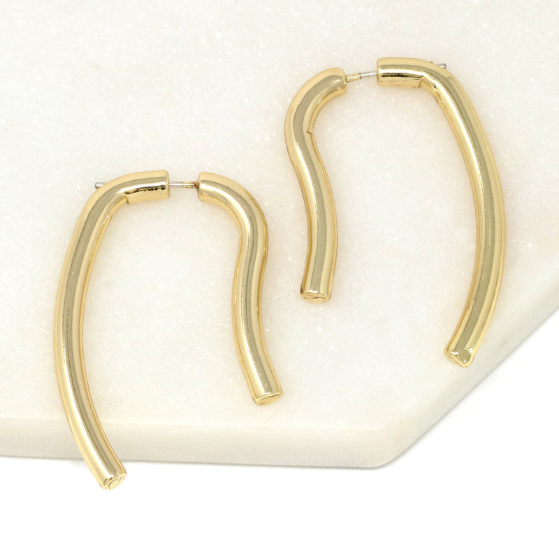 A pair of geometric double-sided drop earrings in gold.