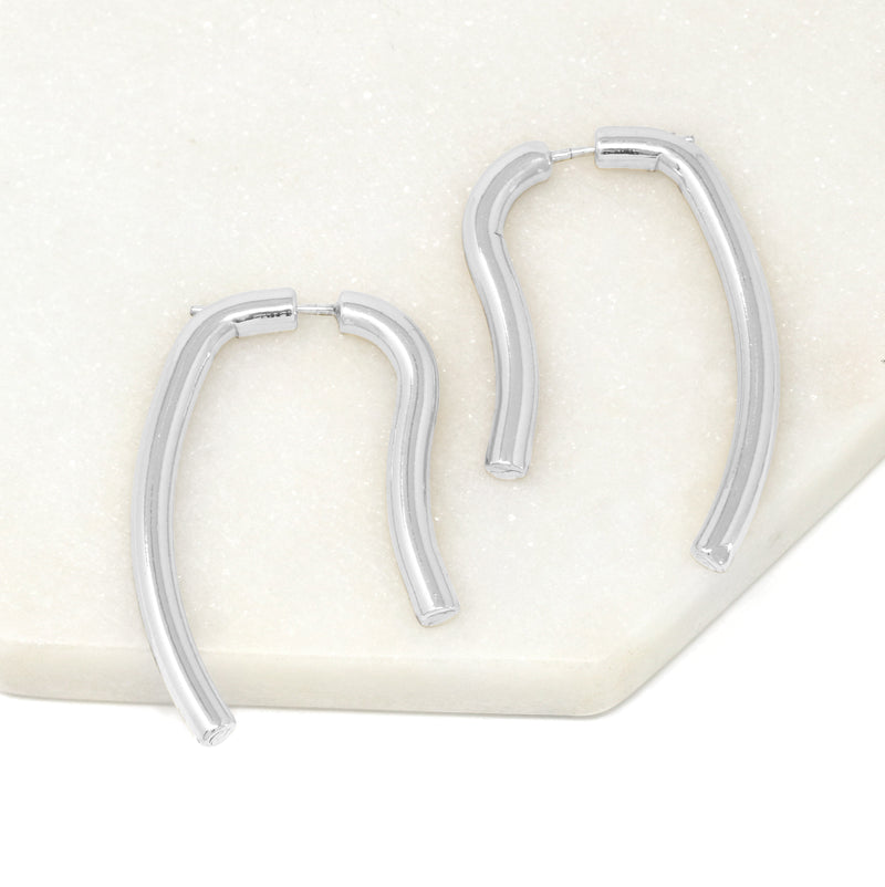 A pair of geometric double-sided drop earrings in silver.