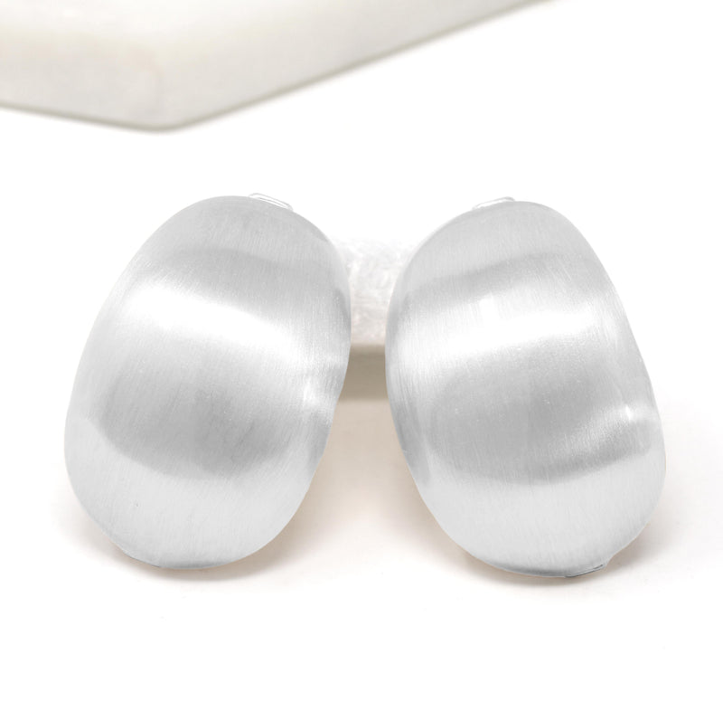 Silver bold statement earrings with hollow bold design.