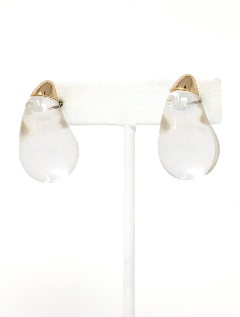 Clear lucite puffy teardrop earrings feature sleek and polished transparent resin teardrops that catch the light beautifully. 