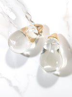 Clear lucite puffy teardrop earrings feature sleek and polished transparent resin teardrops that catch the light beautifully. 
