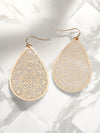 A pair of matte gold teardrop-shaped drop earrings with intricate filigree detailing.