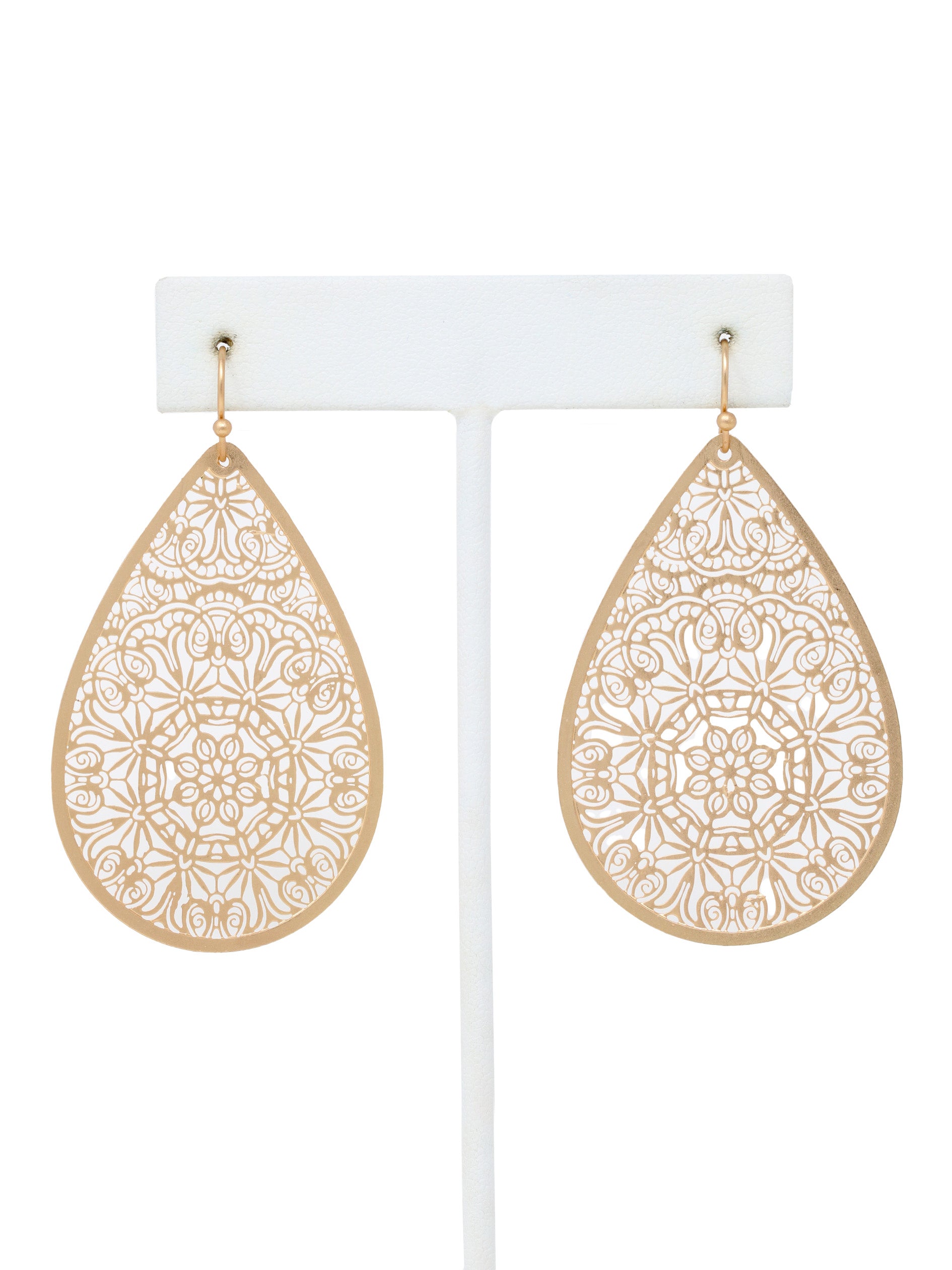 Gold teardrop earrings with intricate patterns on a white background