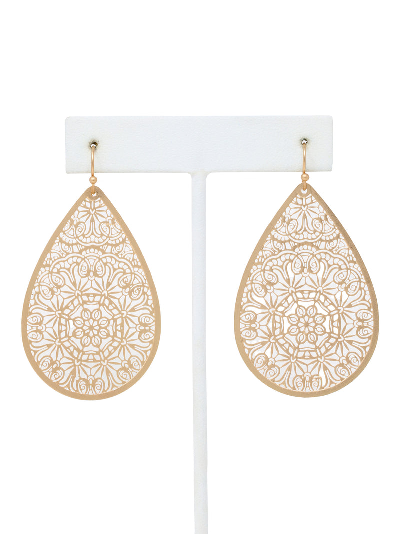 Gold teardrop earrings with intricate patterns on a white background